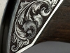 Damasteel knife engraving close-up